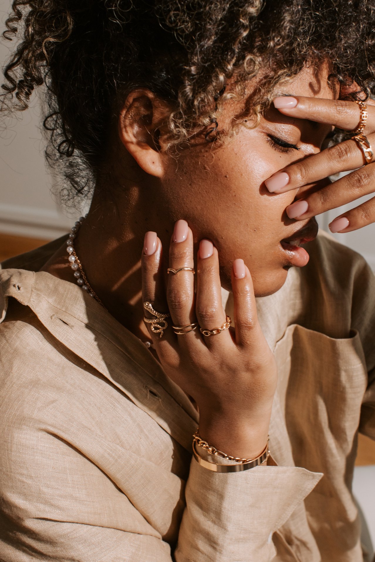 Woman Wearing Gold Jewelry